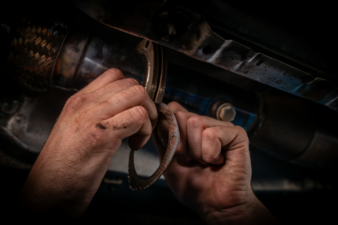 Mechanic repairing a car engine